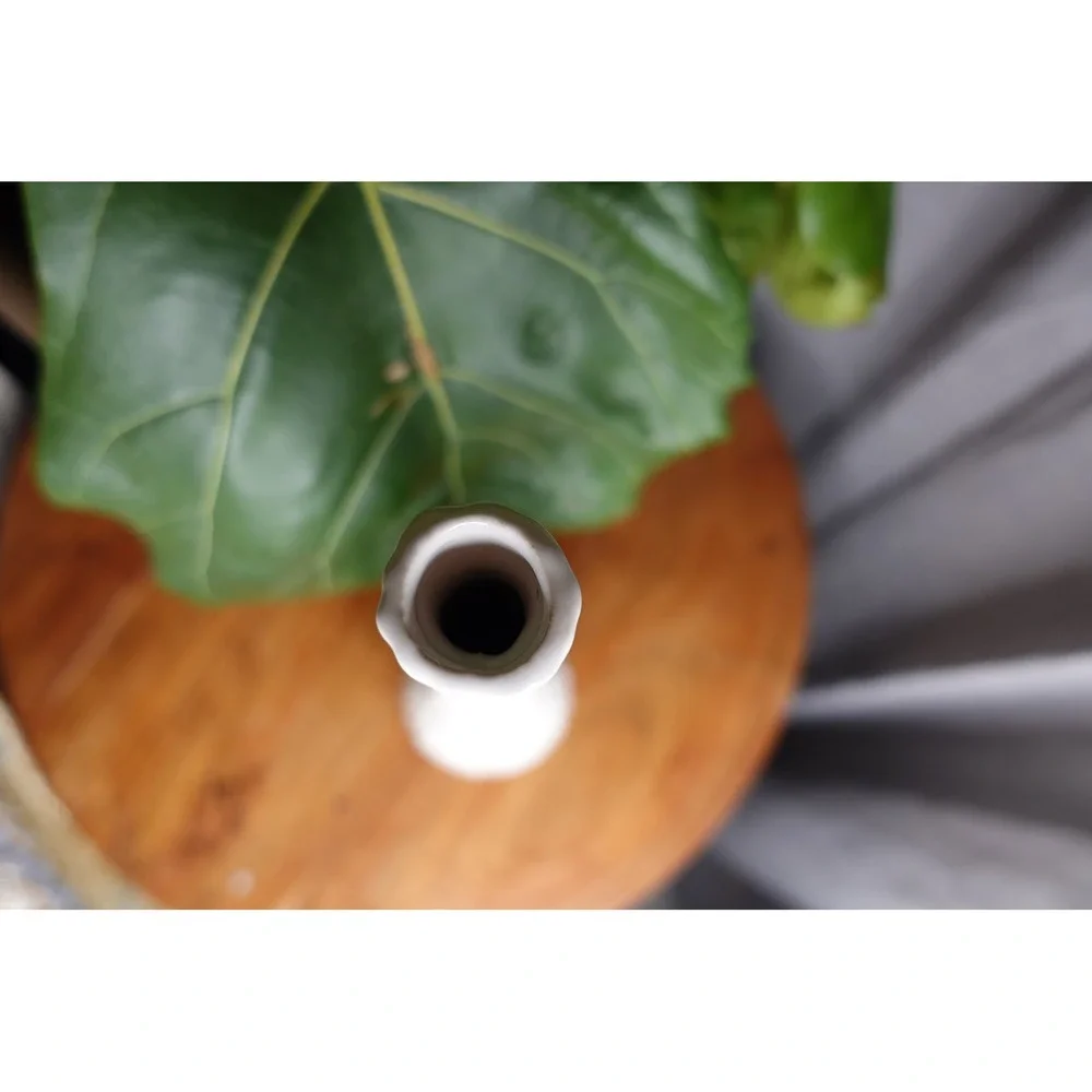 White vase with long neck and‎ gourd like ribbed textured